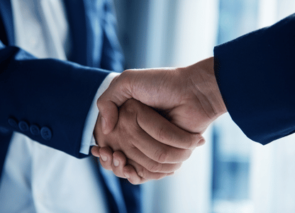 Two business people shaking hands
