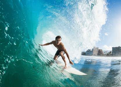 A surfer inside a huge wave