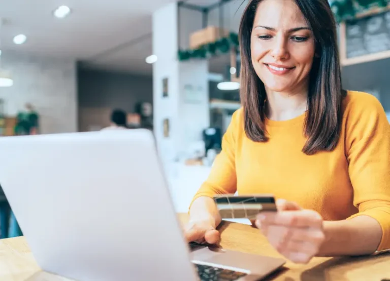 A woman pays online via credit card.